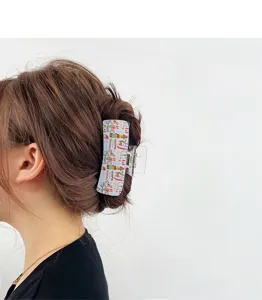 Christmas square hair claw clip for women, festive holiday hair styling accessory for back head.