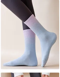 Detail view of women yoga grip socks, gradient blue purple mid-calf non-slip fitness sports.