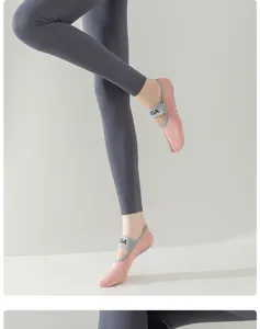 Non-slip yoga socks for women, breathable pilates fitness dance socks with cross strap.