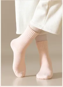 Cozy cashmere blend winter crew socks for women, thick thermal knit floor socks in soft pink.