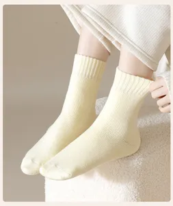 Cozy thick cashmere wool mid-calf socks in soft light yellow, perfect warm winter sleep socks.