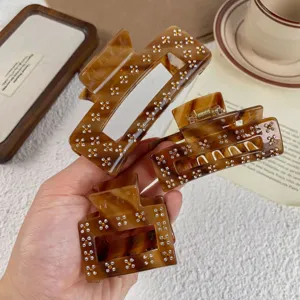 Set di tre mollette per capelli in acetato marrone con strass, elegante accessorio donna.