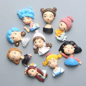 Nahaufnahmen von kreativen Harz Cartoon Mädchen Kopf Figuren, perfekt für Kühlschrankmagnete.