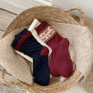 Retro winter fleece warm mid-tube socks with diamond pattern and floral cuff detail.