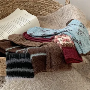 Close-up detail shot of cozy winter vintage crew socks with retro patterns and soft plush texture.