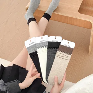 Women's cotton stack socks with delicate vertical stripes, ruffled cuffs, and stylish design.