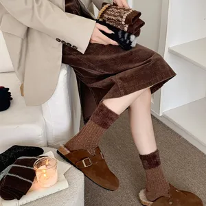 Retro winter warm mid-calf socks with faux mink plush cuffs and ribbed knit design.
