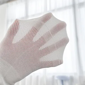Close-up of white breathable mesh men's socks showing soft texture and fine woven knit structure.