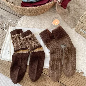 Cozy winter brown mid-tube socks close-up, retro geometric patterns and soft plush fleece texture.