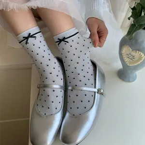 Grey-blue sheer polka dot mesh socks featuring a cute black bow detail for sweet daily wear.