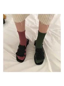 Detail shot of women's mid tube cotton socks with a rolled edge design and candy colors.