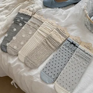 Grey-blue sheer polka dot mesh slouchy socks with lettuce edge and cute bow for ins style.