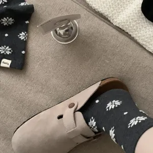 Winter warm cotton socks with snowflake pattern, cozy mid-tube design for women daily wear.