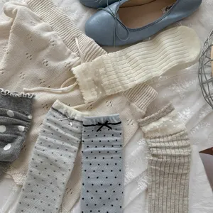 Sweet ins-style polka dot lace bow stackable socks and knitwear set for women, cozy and stylish.