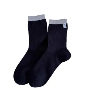 Comfortable women's ribbed crew socks in dark navy with contrasting grey cuffs and cute hearts.