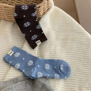 Winter warm cotton mid-tube socks with cute snowflake and polka dot patterns for women.