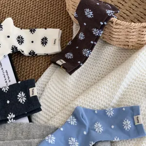Winter women mid-tube cotton socks featuring cozy snowflake and polka dot patterns, warm knit.