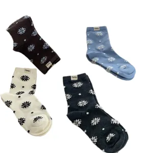 Winter cotton mid-tube socks with cute snowflake pattern and contrast color design for women daily.