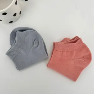 Detailed view of women summer solid color short socks in grey and pink macaron shades.