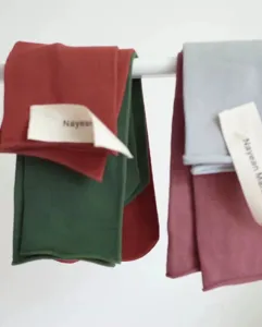 Detail view of colorful rolled-cuff combed cotton mid-calf socks for women and kids.
