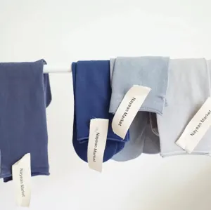 Detail view of comfortable combed cotton candy color roll edge mid-tube women socks.