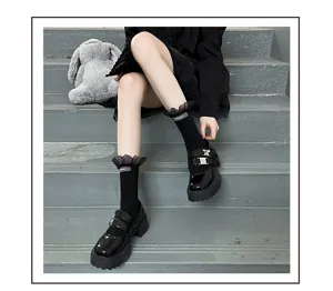 Japanese style sweet black mid-calf socks with mesh ruffles and cute woven label for women.
