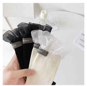 Sweet Japanese style ruffle mesh mid-calf socks with cloth label for women and girls.