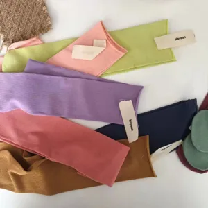 Candy color rolled cuff straight tube socks detail shot, soft breathable cotton knit design.