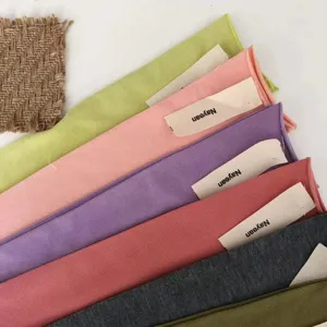 Detailed view of women's ribbed candy-colored socks with rolled edge, soft cotton knit.