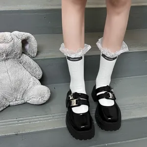 Cute Japanese JK style white mid-calf socks with delicate lace ruffles and trendy fabric label.
