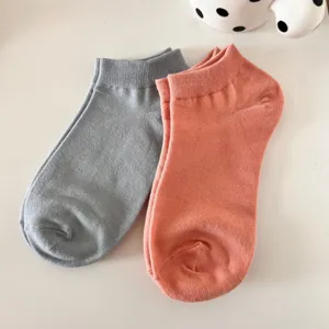 Solid color women's ankle socks detail view, breathable cotton short socks for summer wear.