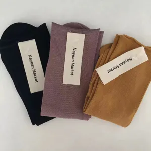 Detailed view of summer ribbed cotton mid-tube women socks in black, purple and caramel.