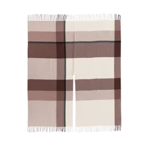 Detail view of the classic plaid open-front cape with elegant fringe, perfect for autumn.