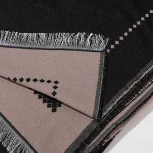 Stylish women's black and khaki shawl scarf detail view featuring fringe and geometric pattern.