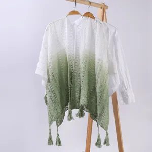 Detailed view of the gradient knitted hollow fringe shawl cape, elegant summer accessory.