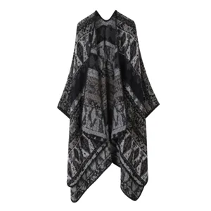 Detailed view of the ethnic style knitted poncho with ink painting pattern, elegant winter cape.