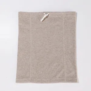 Close-up detail of the ribbed knit neck gaiter, showing soft texture and adjustable drawstring.