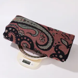 Vintage paisley cashmere feel shawl detail shot showcasing premium soft texture and weight.