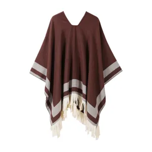 Women's winter knitted pullover cape shawl with cozy stripes and fringe hem details.