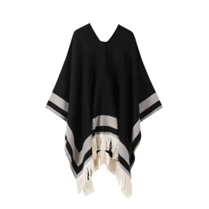 Detailed view of the women winter warm striped pullover shawl cape with chic fringe hemline.