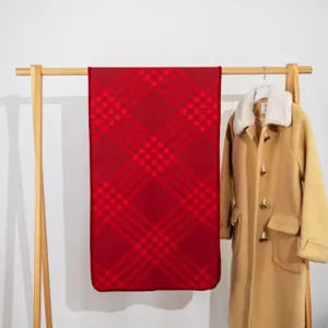 Red plaid scarf detail, classic British style, warm winter accessory, soft fabric texture.