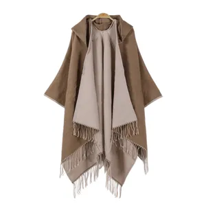Detailed close-up view of the women autumn winter hooded fringe cashmere poncho cloak.
