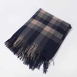 Detailed view of the classic plaid tassel scarf showing soft fabric and neat fringe edges.