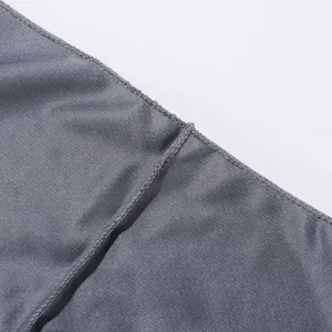 Detailed view of gray quick-drying fabric and neat stitching for outdoor sports headwear.