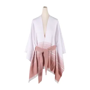 Detailed view of the women's striped open-front poncho with a matching belt and chic fringe hem.