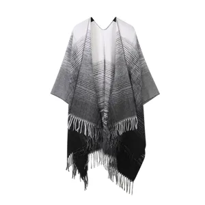 Black and white gradient knit poncho shawl with fringe, cozy warm outer cape scarf for women.