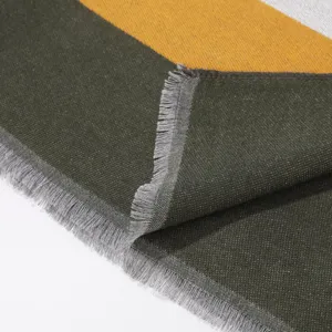 Close-up detail of women's autumn winter colorblock fringe scarf shawl fabric texture.