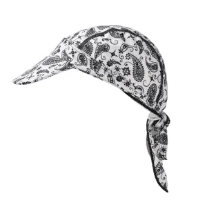 Detail view of the black and white paisley cycling cap showing visor and tie-back straps.
