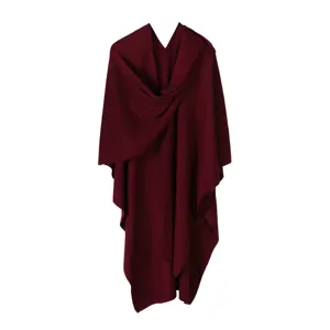 Detailed view of the solid burgundy knitted wrap, highlighting the soft texture and split design.
