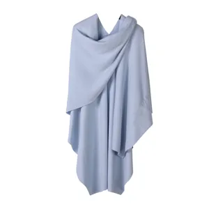 Light blue knitted open poncho shawl, soft core-spun yarn wrap cape detail view.